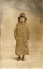 Ruth Wagner as a little girl in a rain coat and hat