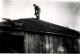 Carl Collett on roof of Maeser home in 1949