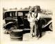 Floyd Michael and Fred horsing around by a car