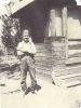 Jule Smith in 1920 next to the covered porch where his parents slept