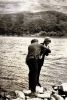 Paul Henry Wager pretending to push an unknown young lady into the water, August 1924